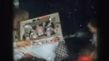 LYNBROOK NEW YORK-1971: Young Boy And Young Girl Go Through Presents With Their Mother