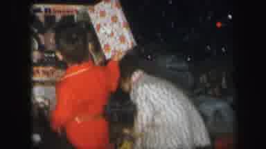 Lynbrook New York (1971): Two Young Children In Pajamas Opening Gifts In Front Of