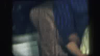 Lynbrook New York (1971): Woman Wearing Blue Dress Holds Baby In A Yellow Blanket