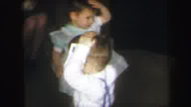 Lynbrook New York (1971): Children Playing And Spinning In Circles With A Mother