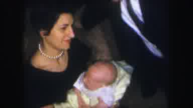 Lynbrook New York (1971): Mother And Father Delightfully Holding Their Baby With