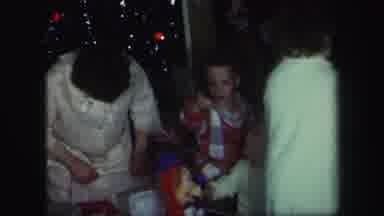 Lynbrook New York (1971): A Family Still In Pajamas Opening Up Gifts In Front Of A