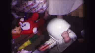 Lynbrook New York (1971): Child Sitting On Floor Between People With A Football