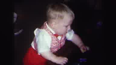 Lynbrook New York (1971): A Small Boy Is Playing With Small Cars In The House