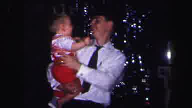 Lynbrook New York (1971): Father Holding Child And Showing Him To The Camera