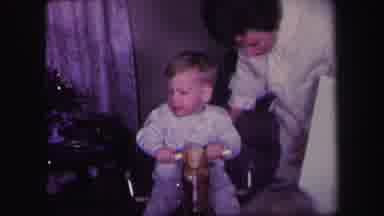 Lynbrook New York (1971): A Small Boy Is Playing In The Wooden Horse With Help Of