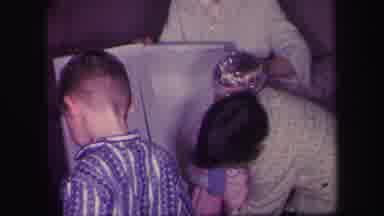 Lynbrook New York (1971): Kids Putting Away A Doll In A Box While Another Toddler