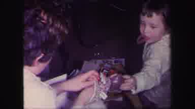 Lynbrook New York (1971): Mother Plays With Puppet As Little Girl Tries To Pull It