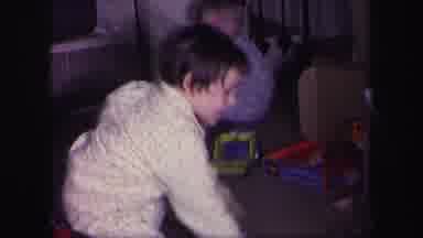Lynbrook New York (1971): A Child Is Playing A Game With A Ball Possibly On