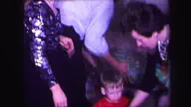 Lynbrook New York (1971): Family Dressed Up Sorting Through Different Wrapped