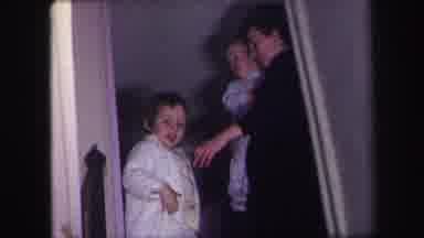 Lynbrook New York (1971): Child Waving And Woman Holding Baby Closing A Door
