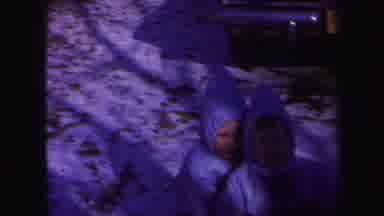 Lynbrook New York (1971): Three Kids Dressed In Winter Snowsuits Sitting On A