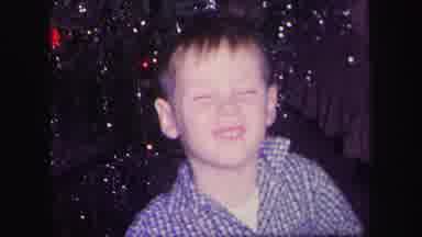 Lynbrook New York (1971): Kid Being Goofy For Camera On Christmas Day As His