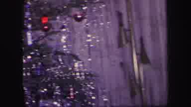 Lynbrook New York (1971): Two Children Watching A Toy Train Running Under The