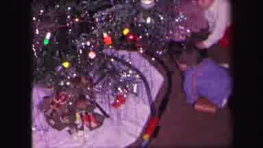 LYNBROOK NEW YORK-1971: Kids Watching Trains Pass Around The Tree During Christmas