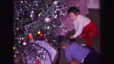 Lynbrook New York (1971): The Two Children Are Watching The Toy Train Runs Under