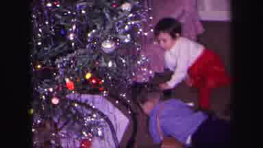 Lynbrook New York (1971): Small Children Playing With A Train Set Under A