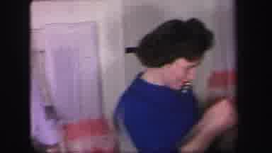 Lynbrook New York (1971): Two Well Dressed Men Watching Woman In Blue Dress Handle