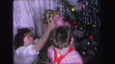 Lynbrook New York (1971): An Adult Placing A Blonde Wig On A Child As She Shows It