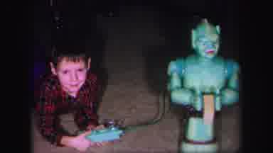 Lynbrook New York (1971): Boy Plays With Turquoise Robot While Others Play With