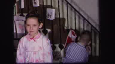 Lynbrook New York (1971): Three Children Having Fun Hanging Their Christmas