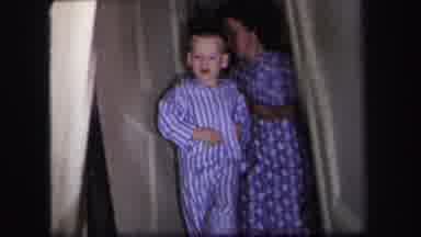LYNBROOK NEW YORK-1971: Mother Opens Door And Lets Children Go Downstairs And