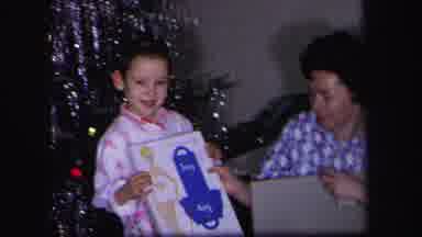 Lynbrook New York (1971): Adult Woman And Young Boy With Gift Near Christmas Tree