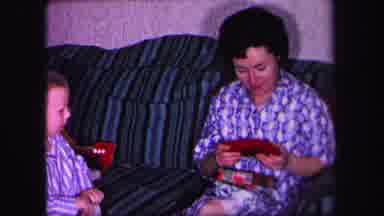 Lynbrook New York (1971): Christmas Morning Mother Opens Presents While Two