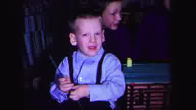 Lynbrook New York (1971): Boy Wearing Blue Shirt Plays With Dark Green Building