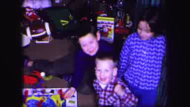 Lynbrook New York (1971): Three Childrens Are Playing With The Toy And Smiling