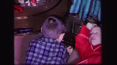 Lynbrook New York (1971): Boy Wearing Blue Shirt Plays With Train Set On Floor