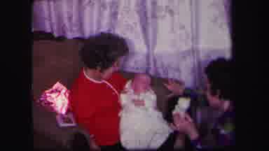 Lynbrook New York (1971): A Seated Woman Holds An Infant While Another Woman Shows