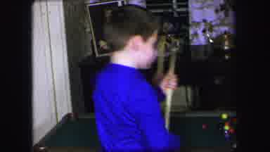 Lynbrook New York (1971): Two Boys On In Blue And One In Red Play Fight Over A