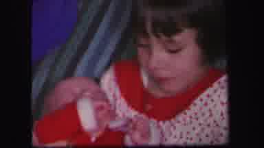 Lynbrook New York (1971): Girl Handling A Baby While Her Brother Ties Tennis