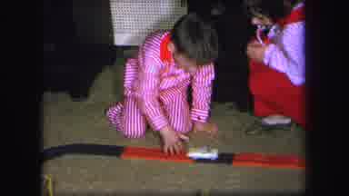 Lynbrook New York (1971): Children Sitting On The Floor And Playing A Kids Car