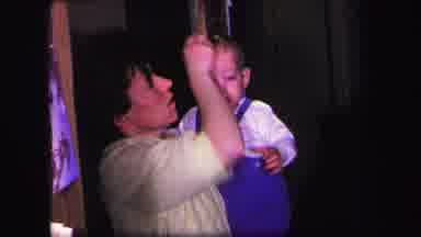 Lynbrook New York (1971): The Mother Is Combing The Hair Of The Child Held In Her