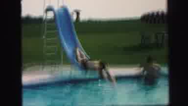 Lynbrook New York (1971): Man Dives Down Slide Head-First Into Pool While A Man