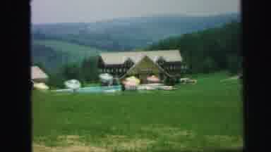 LYNBROOK NEW YORK-1971: Camera Looks At Building Then Zooms Out To Capture The