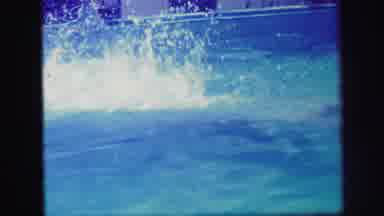 Lynbrook New York (1971): Person Dives Into Pool While Others Play With