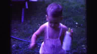Lynbrook New York-1971: Baby Walking Outside With Bottle