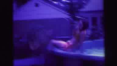 Lynbrook New York (1971): Dad And Children Roughhouse And Splash In Round Backyard