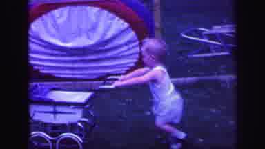 Lynbrook New York (1971): Toddler Pushing Baby Stroller With Another Toddler