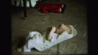 Lynbrook New York (1971): Baby In Bouncer Wiggles Around On The Floor By Himself