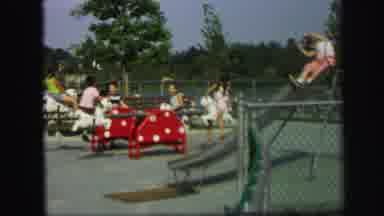Lynbrook New York (1971): Group Of Young Kids Playing On See Saws And A Slide In A