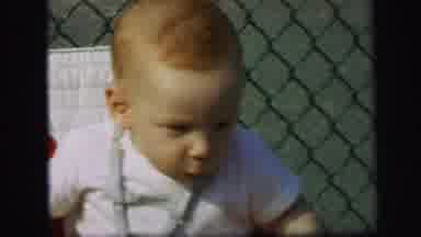 Lynbrook New York (1971): A Child Sits On The Chair And Takes It Behind Him