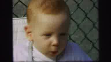 Lynbrook New York (1971): Baby Is Enjoying Swinging And Riding The Toy Pony In