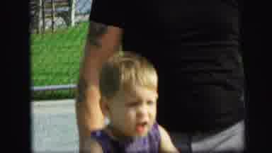 Lynbrook New York (1971): A Child Playing At A Park With His Father In What