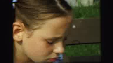Lynbrook New York (1971): Girl In A Dress On A Bench She Seems To Be Talking Or