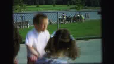 Lynbrook New York (1971): Boy In Play Park Near A Lake On A Bouncing Play Park Toy