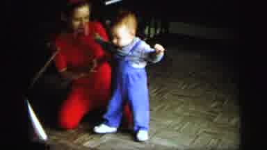 Lynbrook New York (1971): Baby Starting To Take His First Steps And Mother Is Very